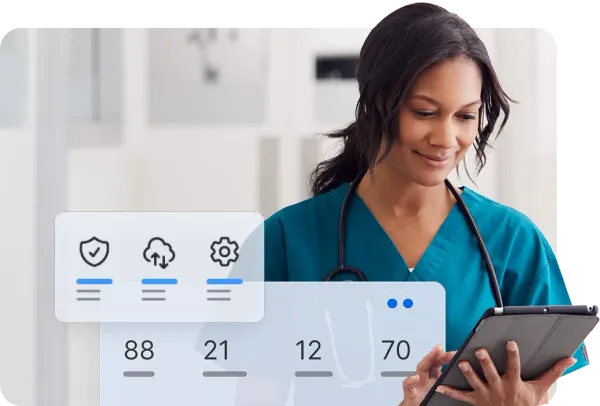 A healthcare professional in teal scrubs uses a tablet displaying patient data managed by Jamf.