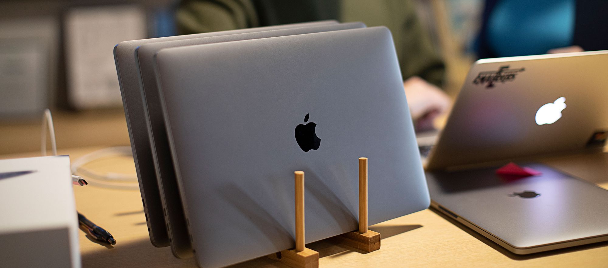 5 MacBooks on a desk