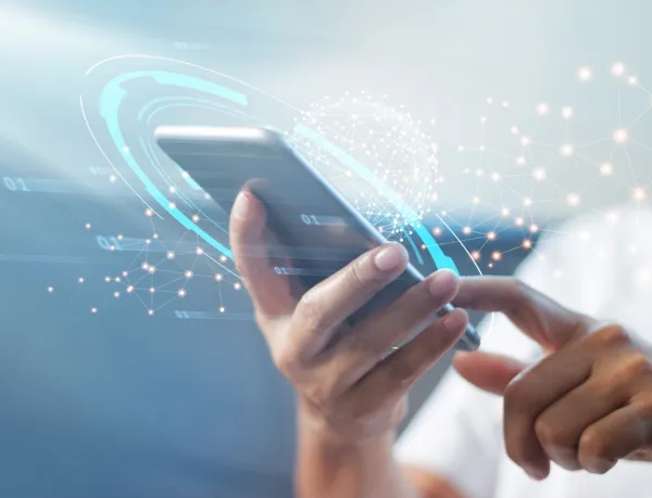 Image of someone interacting with an iPhone.
