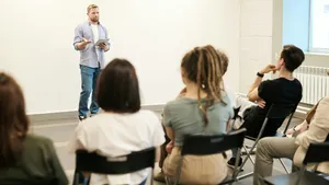 Teacher performing a lesson using an iPad managed by Jamf.