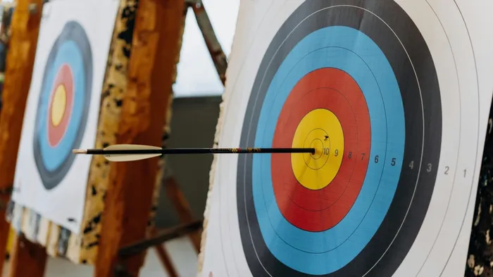 Archery target with an arrow near the center