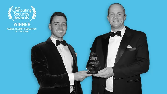 Monochrome photo of two Jamf representatives accepting the Mobile Security Solution of the Year award