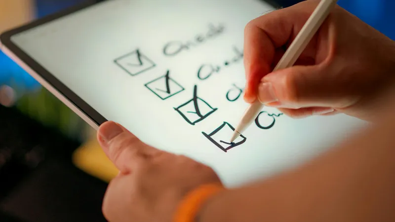 Closeup of a handwritten checklist on an iPad managed by Jamf School