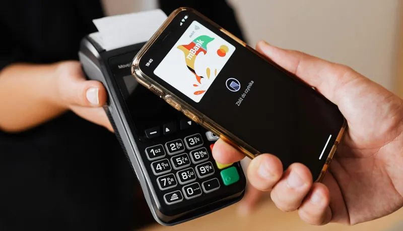 iPhone being used for tap to pay at a retailer.