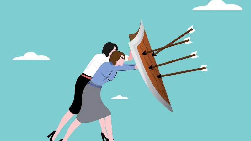 Illustration of two women: one wearing CyCraft colors and one wearing Jamf colors, holding up a shield together. Arrows are stuck in the shield, but they are unharmed.