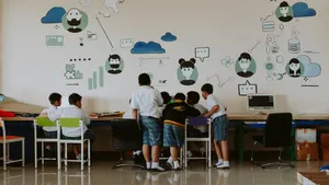 Students gathered around a computer
