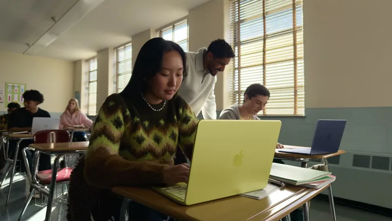 Student using a lime green MacBook Neo