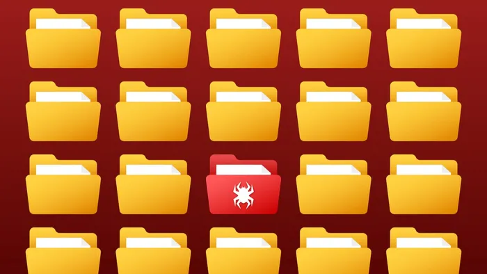 Array of yellow folders with one exception: a red one in the center with a bug embossed on it