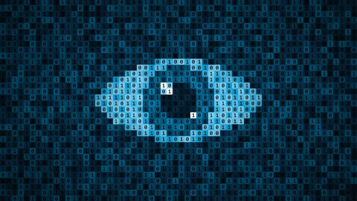 Squares with binary code, overlaid with a menacing eye
