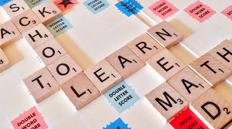 Scrabble letters that spell out school, learn, math, to, read