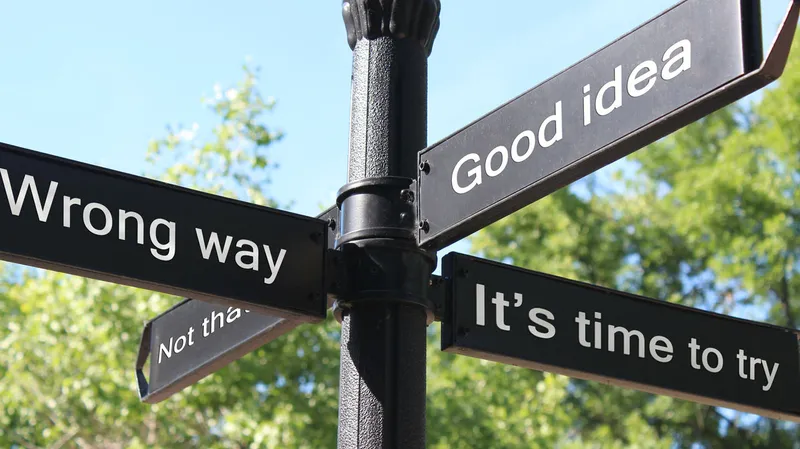 Sign post with conceptual phrases indicating right or wrong paths to take