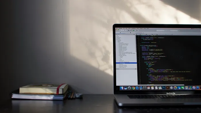 Macbook showing swift code in a code editor