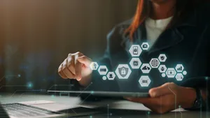 Person using an iPad, overlaid with graphics showing identity and access concepts