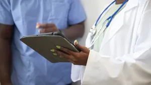Doctor using an iPad managed by Jamf