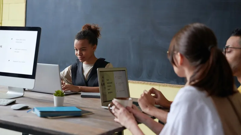 Young students using Macbooks that are managed by Jamf for learning