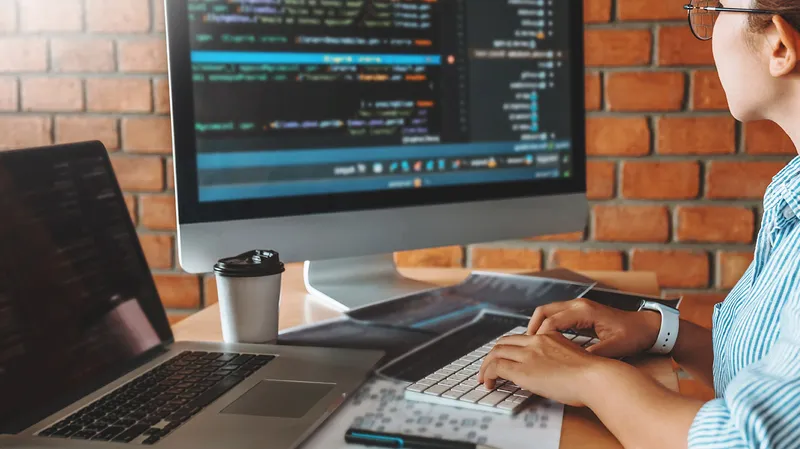 person working at computer desk