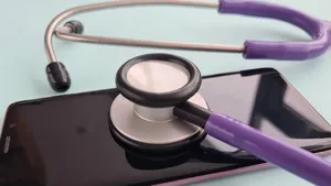 Stethoscope rests on top of iPhone managed by Jamf.