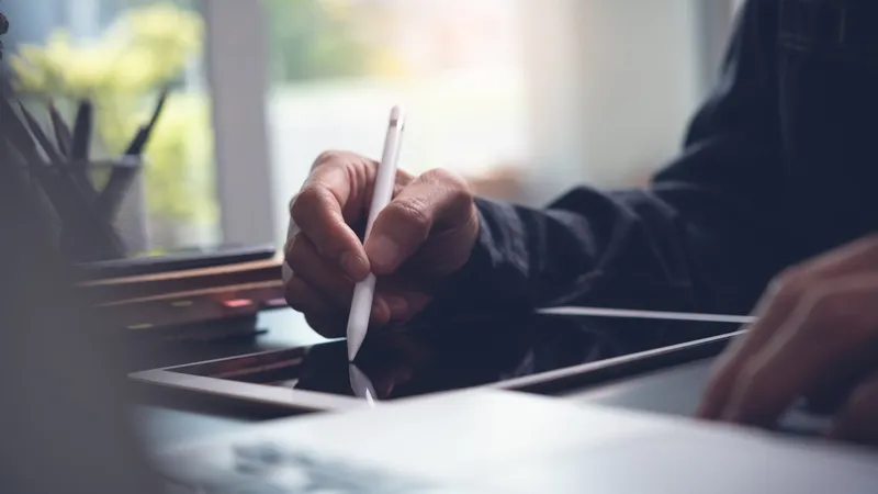 Using a stylus pen to take notes digitally on an iPad managed by Jamf.