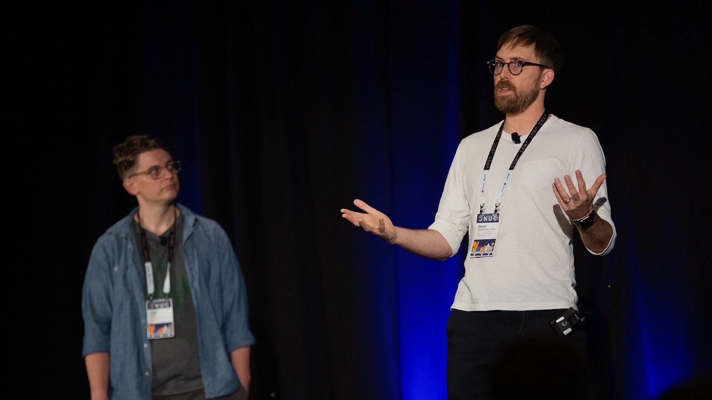 Two Jamf presenters on stage at JNUC 2023.