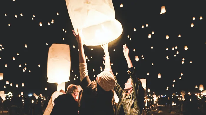 Grouping of Jamf admins releasing light-filled kites celebrating the release of Jamf Pro 11.1