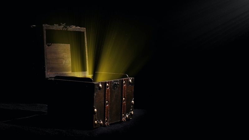 Treasure chest open with gold light shining from within
