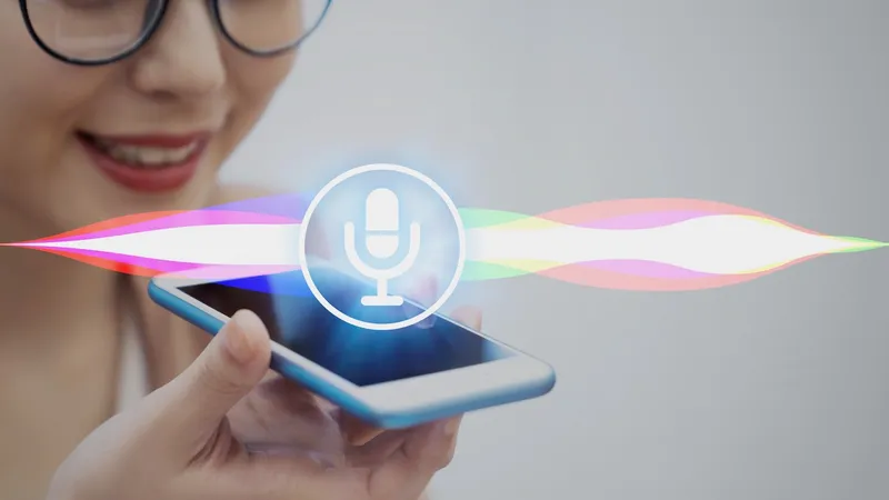 Person uses voice control to give commands to iPhone managed by Jamf.