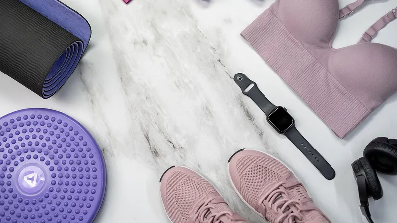 Exercise equipment laid out and an Apple Watch managed by Jamf.