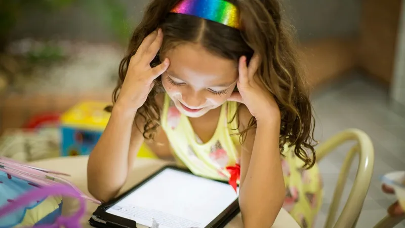 Young student using an iPad for learning