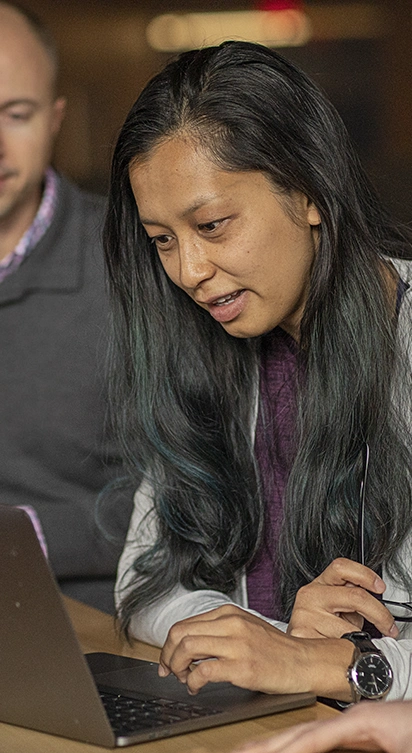 An employee accesses work resources on a MacBook after presenting correct credentials on a verified device.
