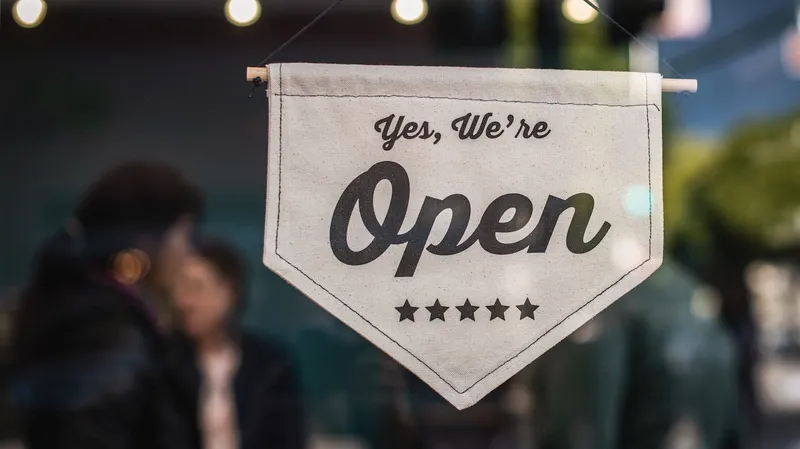A sign on a store window reading